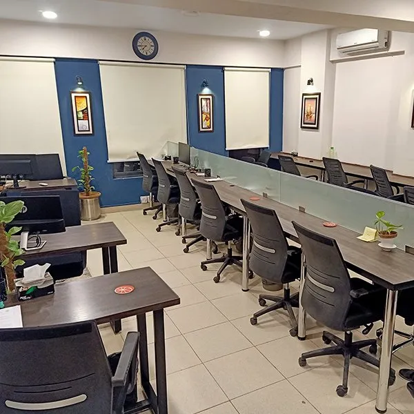 The Bullpen coworking space in DHA Karachi — desks and natural light